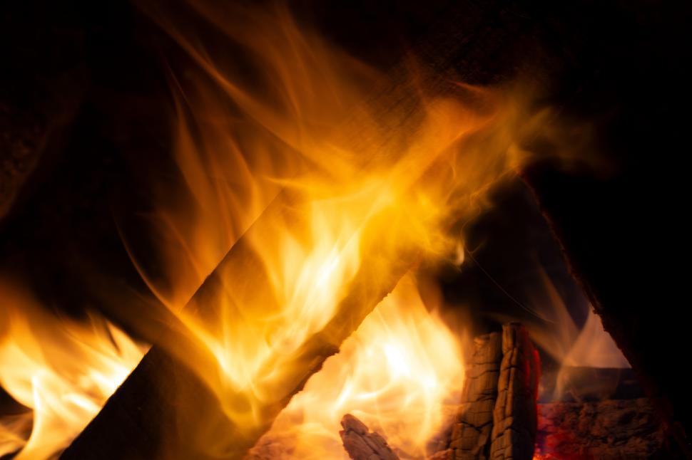 Free Image of A fire burning in a fireplace 