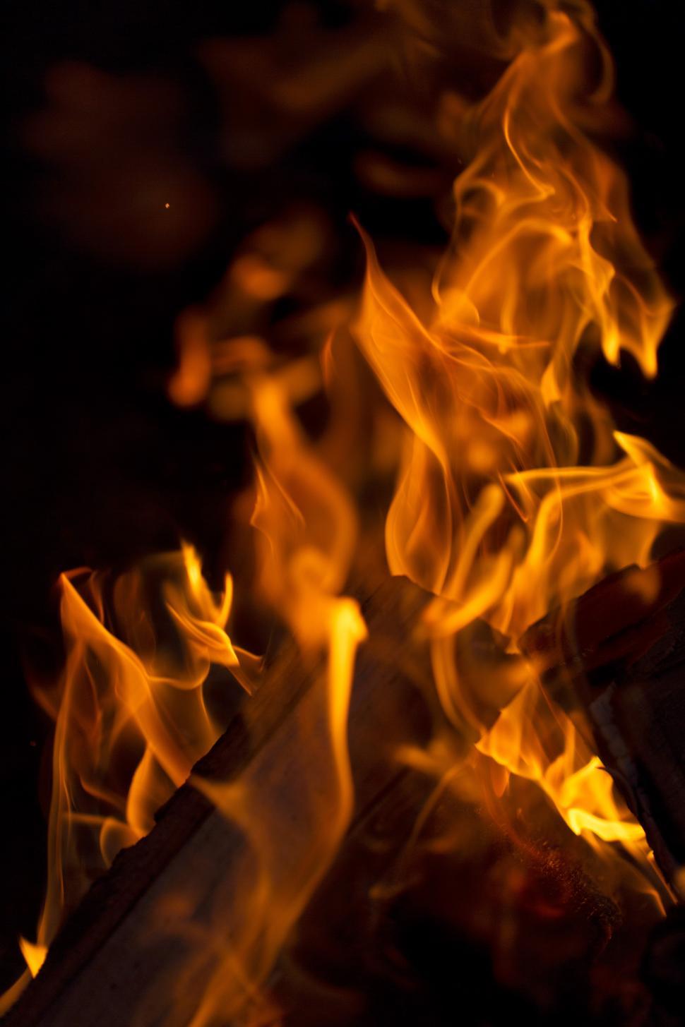 Free Image of A fire burning in a fireplace 