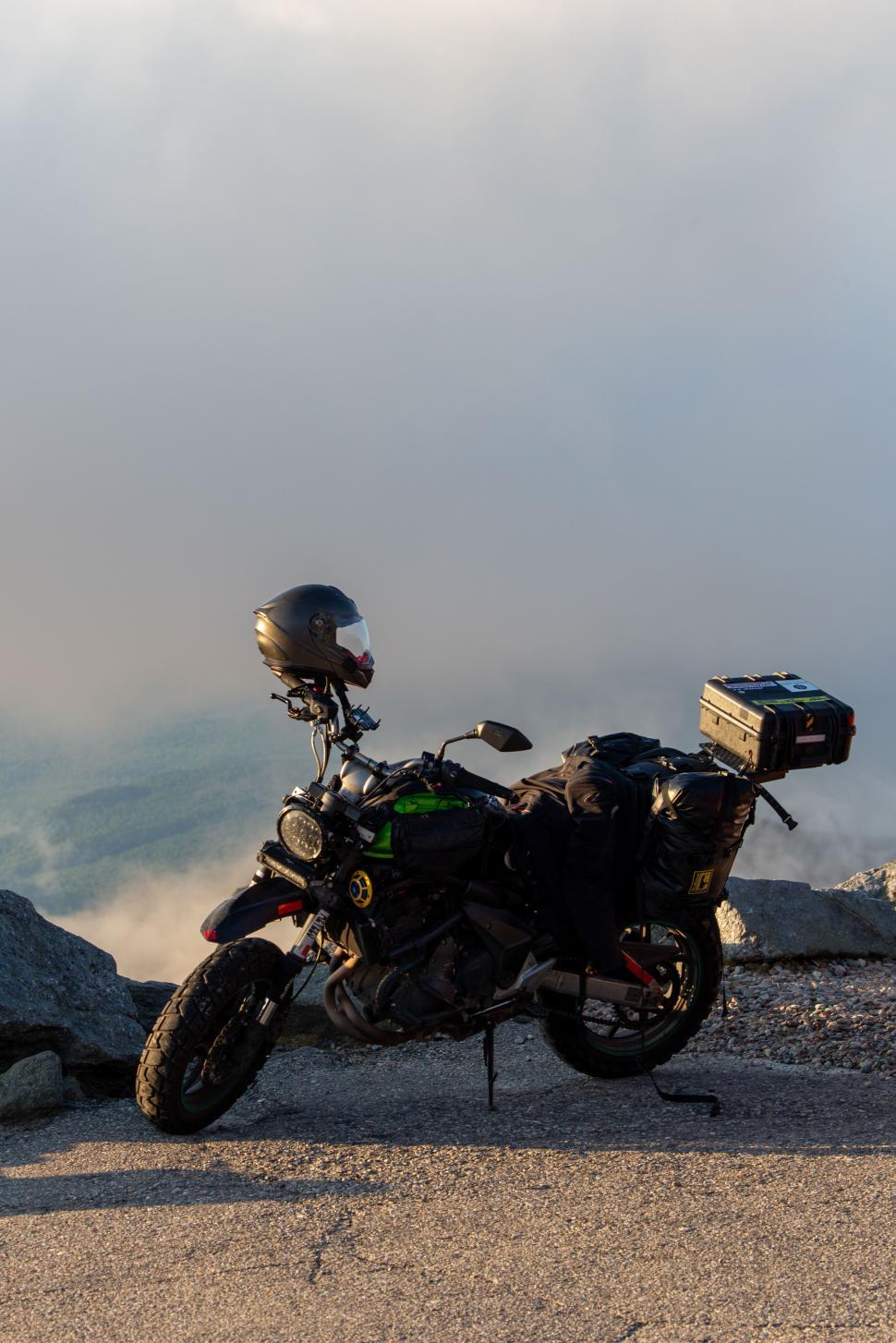 Free Image of A motorcycle parked on a rocky hill 