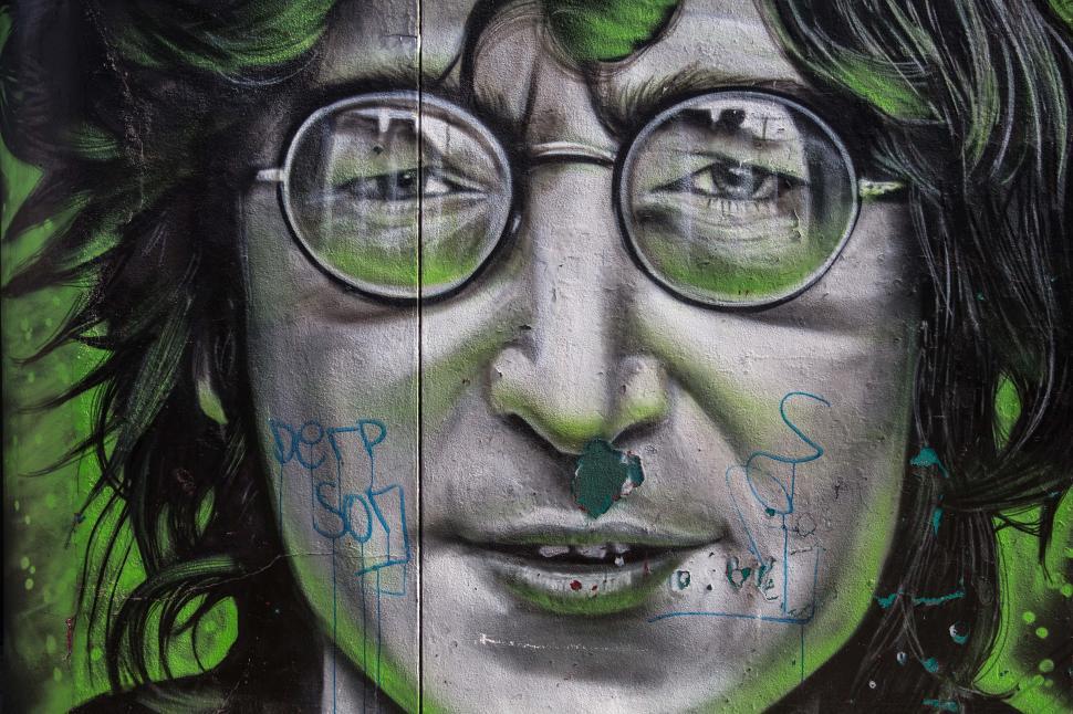 Free Image of A graffiti of a man with glasses 
