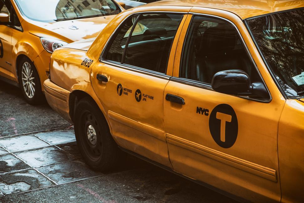 Free Image of A yellow taxi cab on a street 