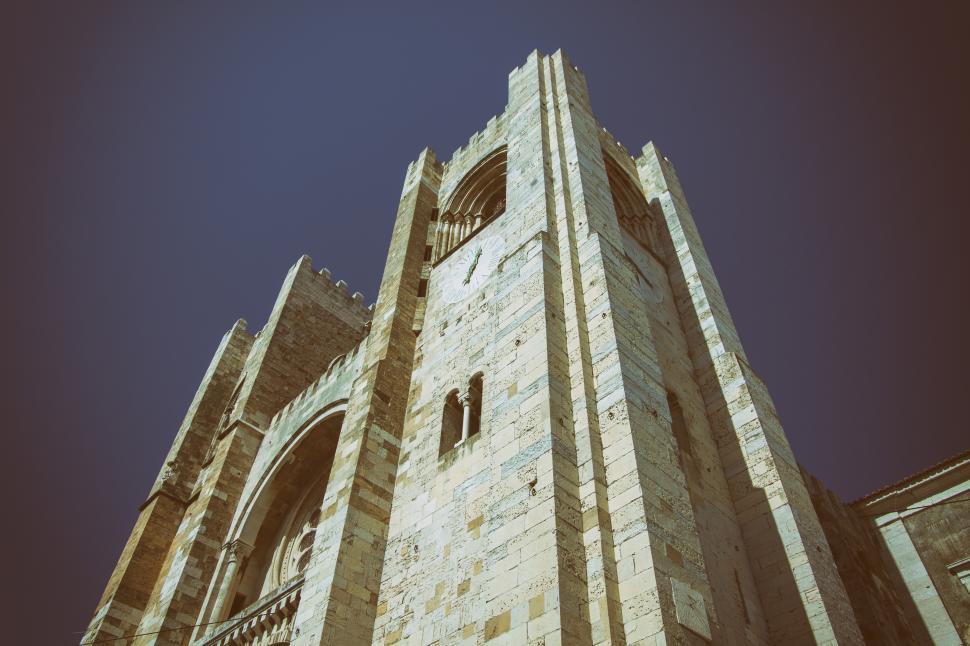 Free Image of A stone building in Lisbon with a tower 