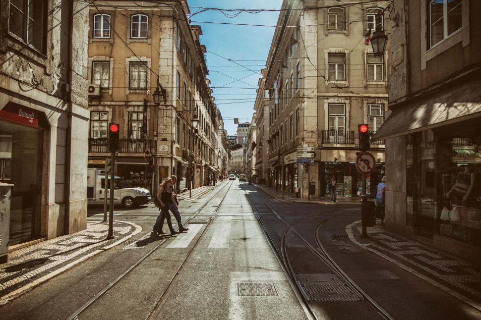 Free Image of A person crossing a street in a city 