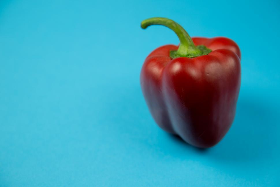 Free Image of A red pepper with a green stem 