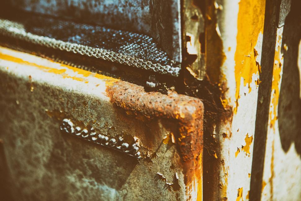 Free Image of A close up of a rusted metal door 