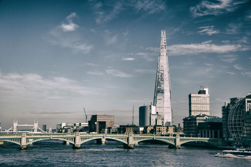 Free Image of A bridge over water with The Shard, London, England 