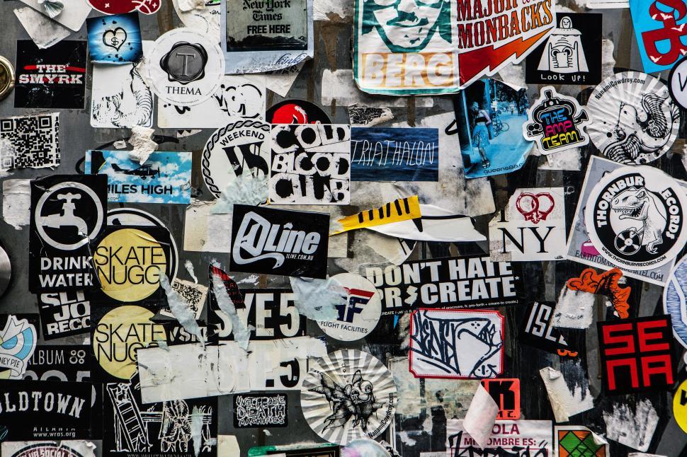 Free Image of A wall with many stickers 