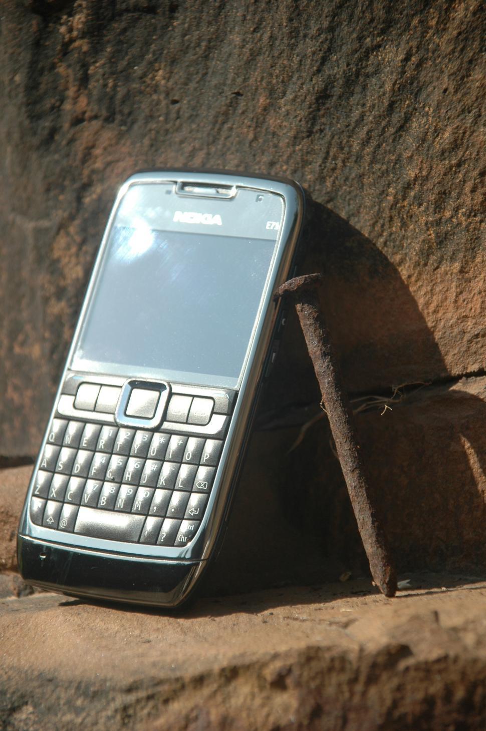 Free Image of Cell Phone Resting on Rock 