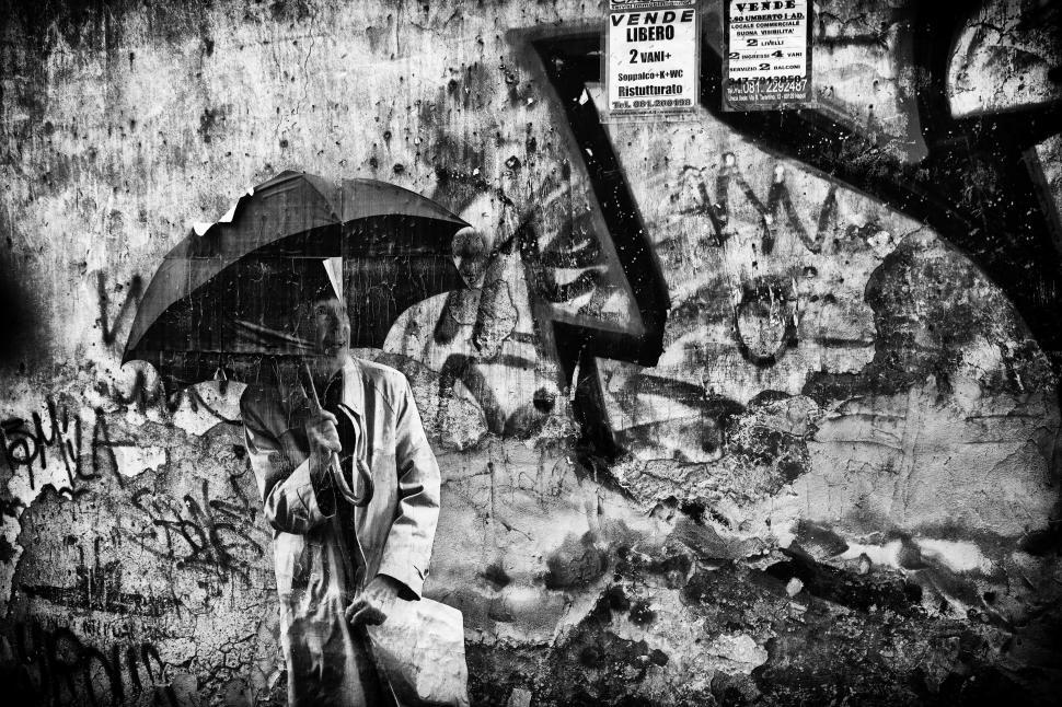 Free Image of A person holding an umbrella in abstract composition 