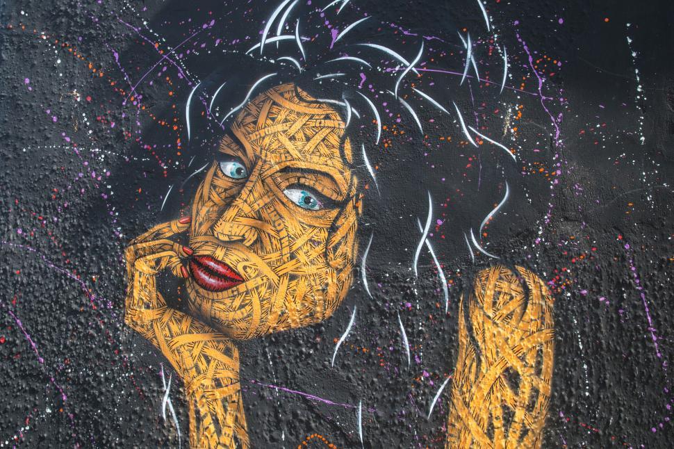 Free Image of A graffiti of a womans face - Amy Winehouse 