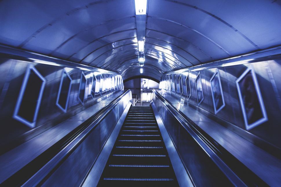 Free Image of A escalator going down a tunnel 