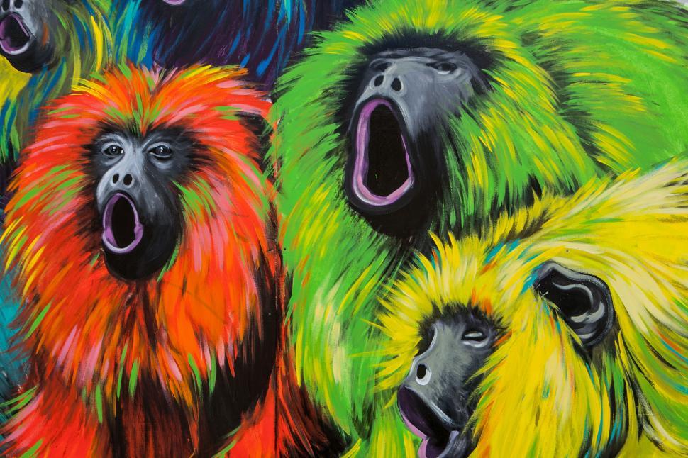 Free Image of A group of colorful monkeys with mouth open 
