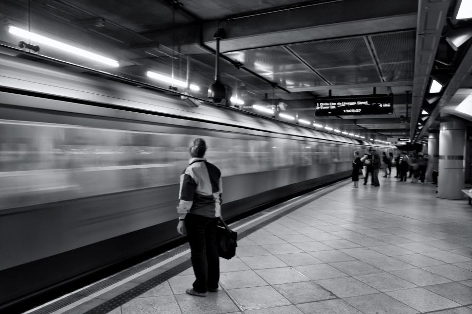 Free Image of A person standing in a train station 