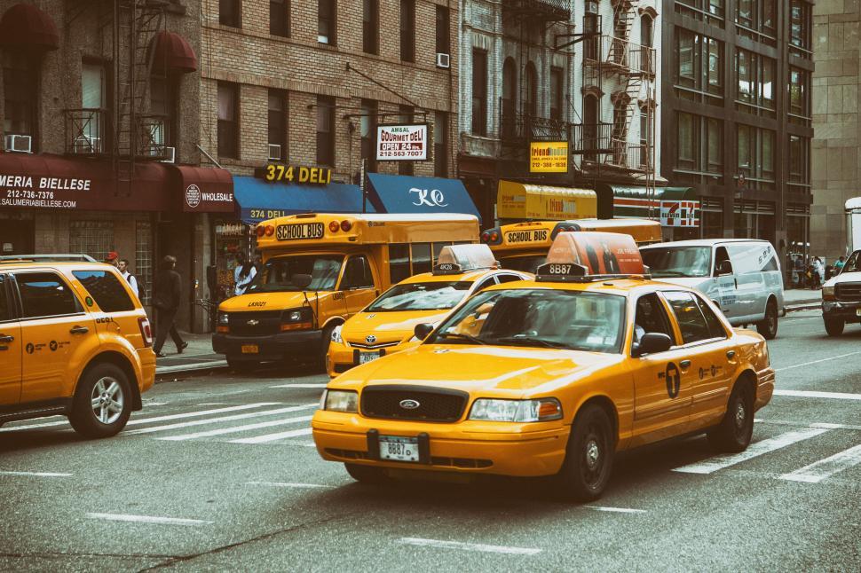 Free Image of A group of yellow taxi cars on a street 