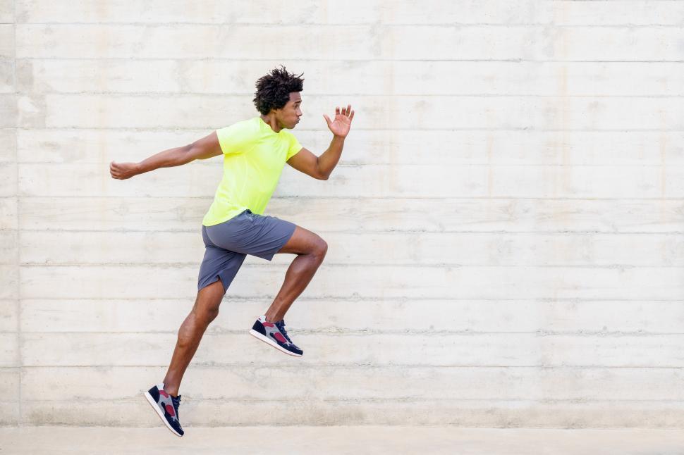 Free Image of Black man training running jumps to strengthen his legs. 