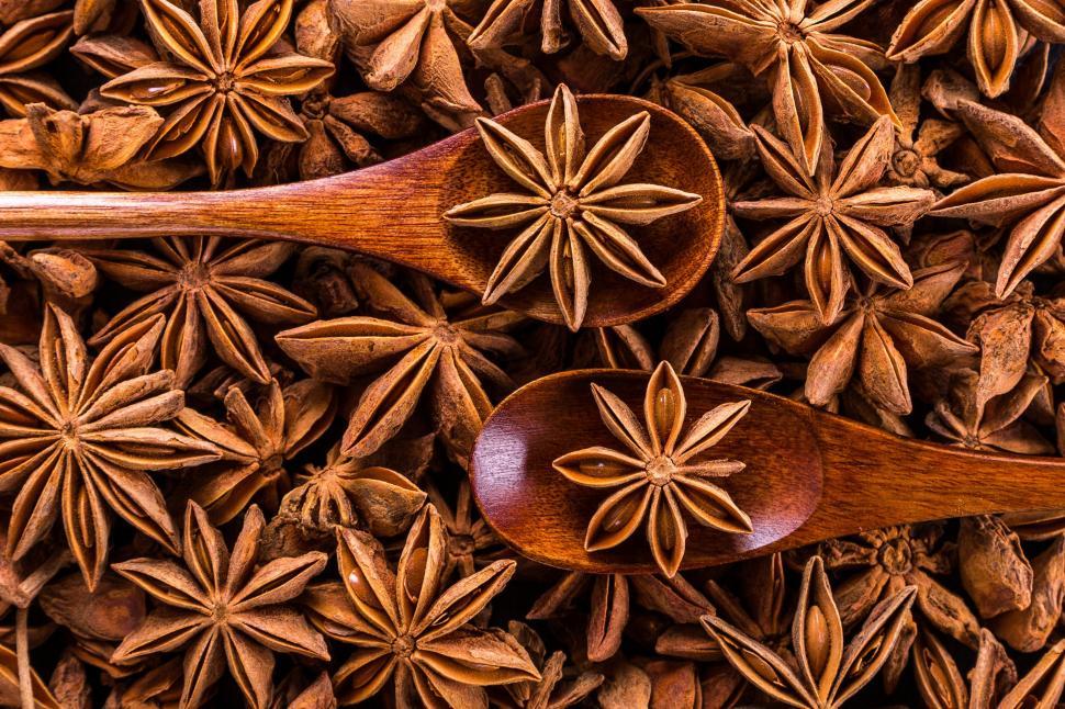 Free Image of A wooden spoons with anise stars 