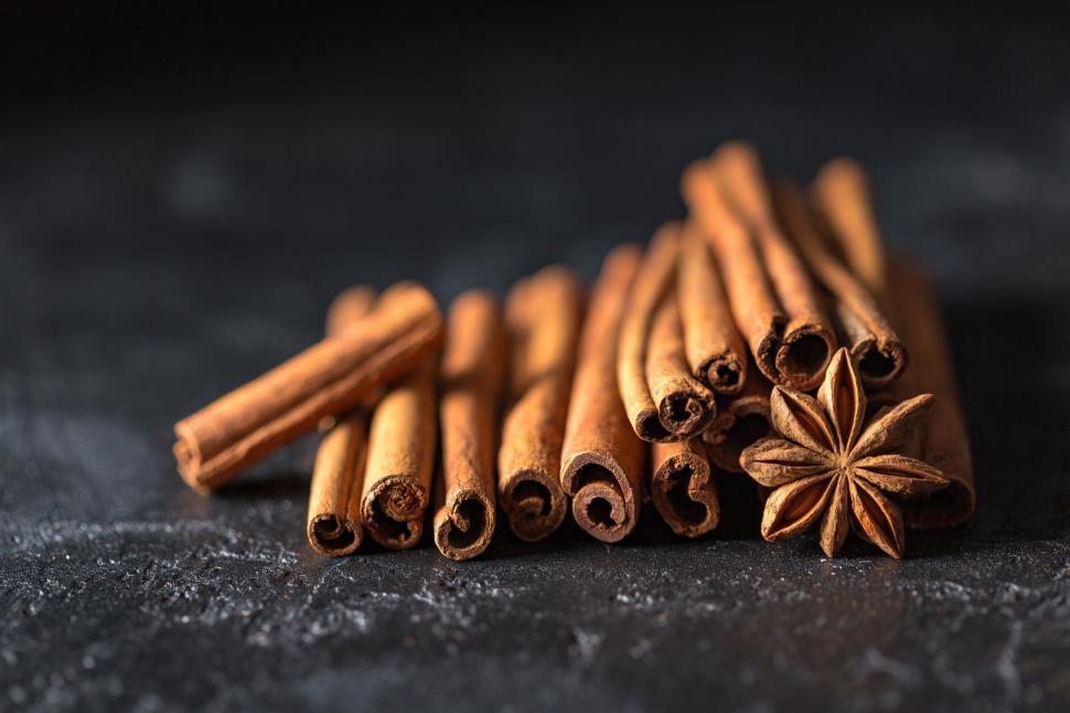 Free Image of A group of cinnamon sticks and anise 