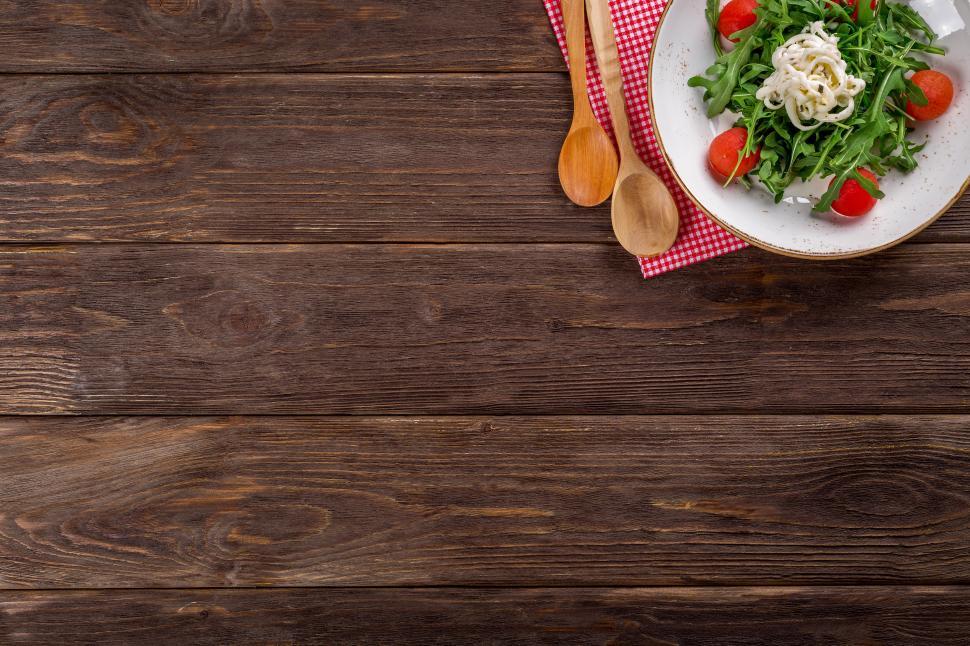 Free Image of A plate of food on a wooden table 