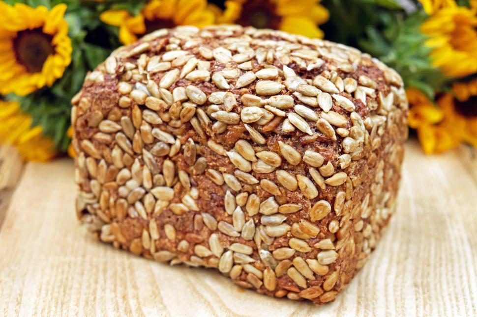Free Image of A loaf of bread with sunflower seeds on it 