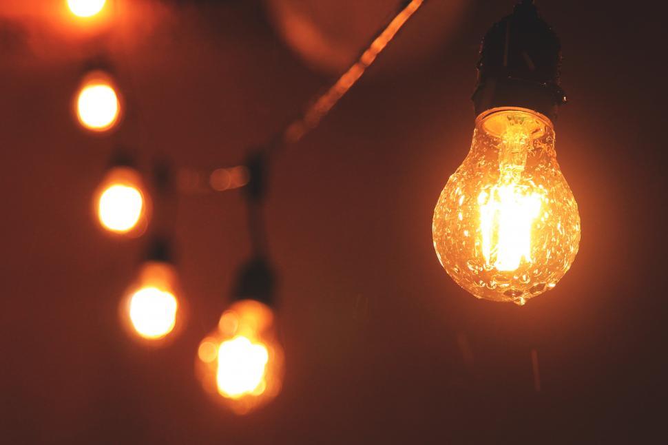 Free Image of A string of lights with a light bulb 