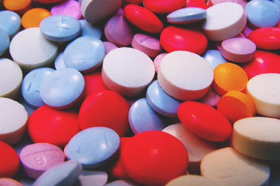 Free Image of A pile of colorful round pills 