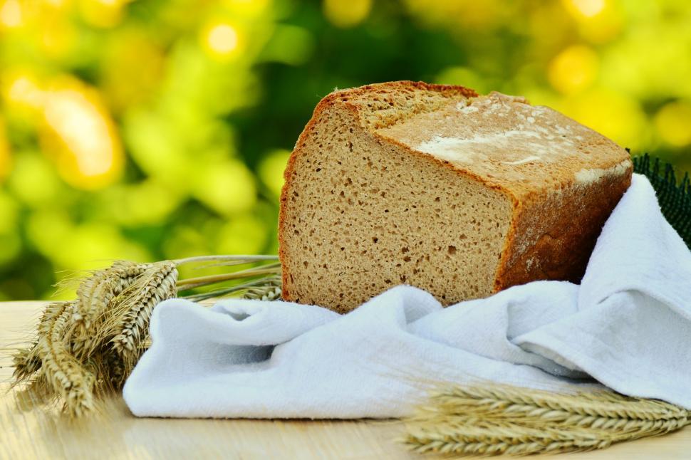 Free Image of A loaf of bread and wheat 