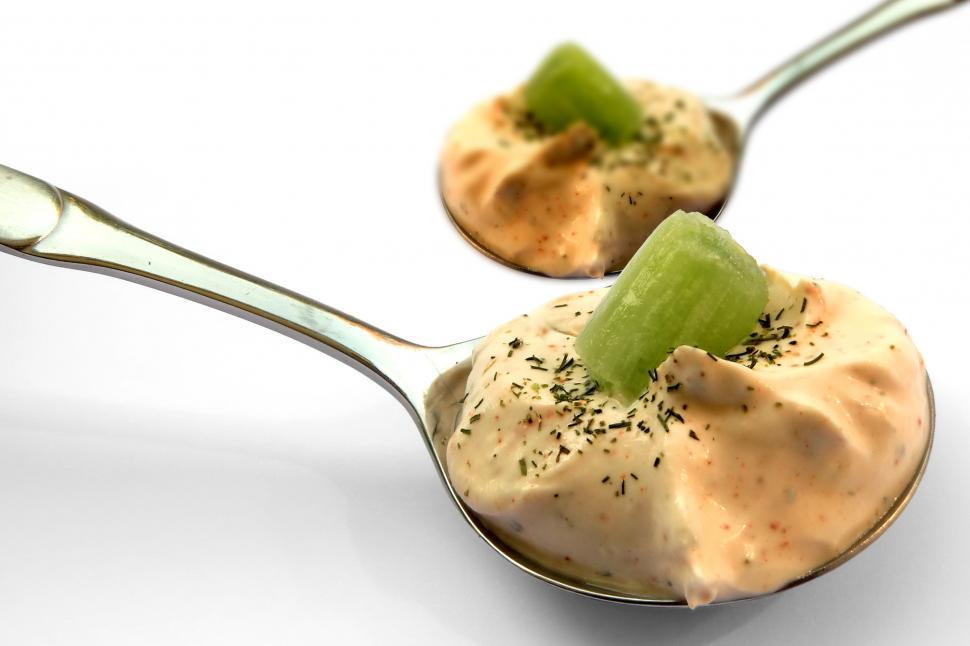 Free Image of Spoons with food on top and celery on top 