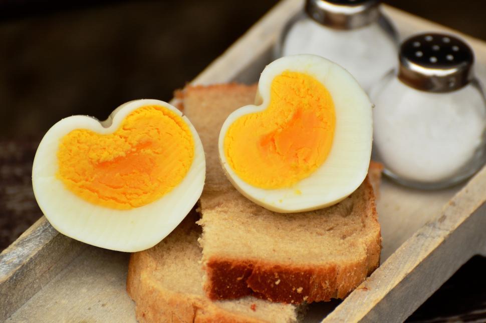 Free Image of A hard boiled egg on a piece of bread 