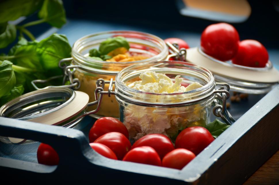 Free Image of A tray of food with tomatoes and cheese 