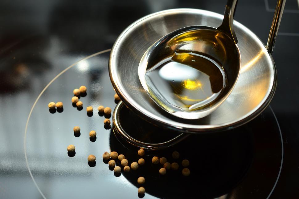 Free Image of A spoon and a bowl of oil 