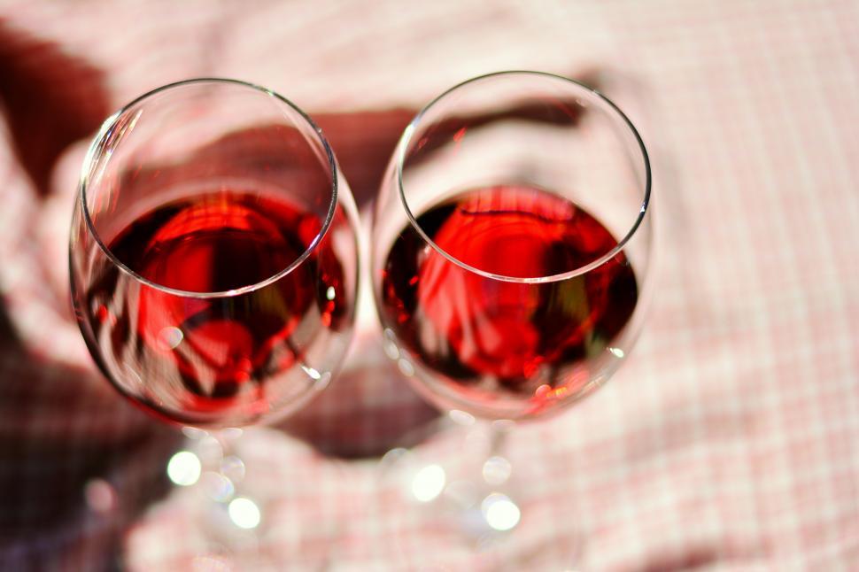 Free Image of Two Glasses of Red Wine on Table 