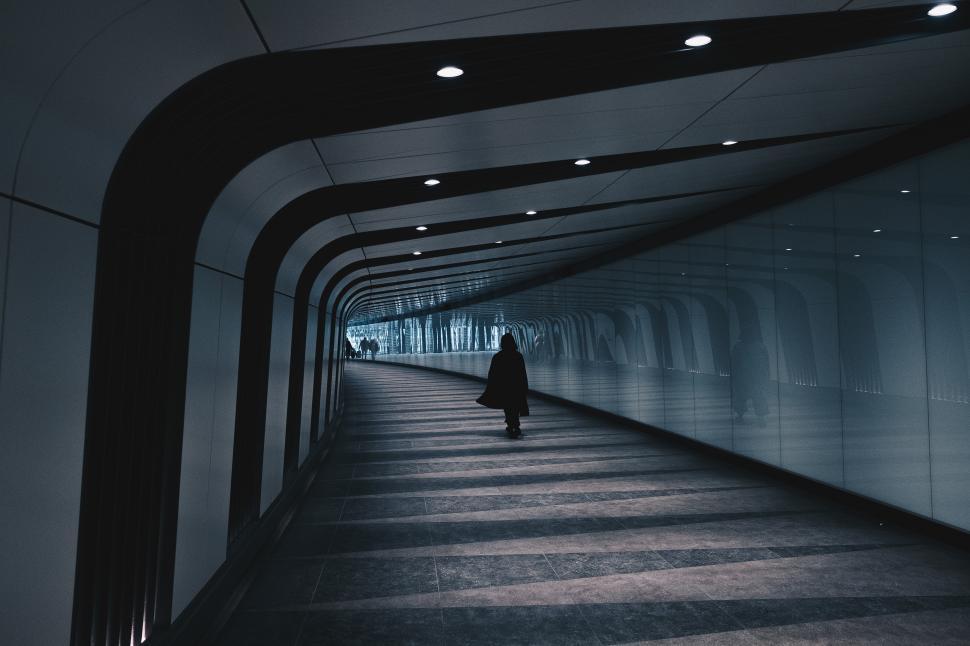 Free Image of A person walking in a tunnel 