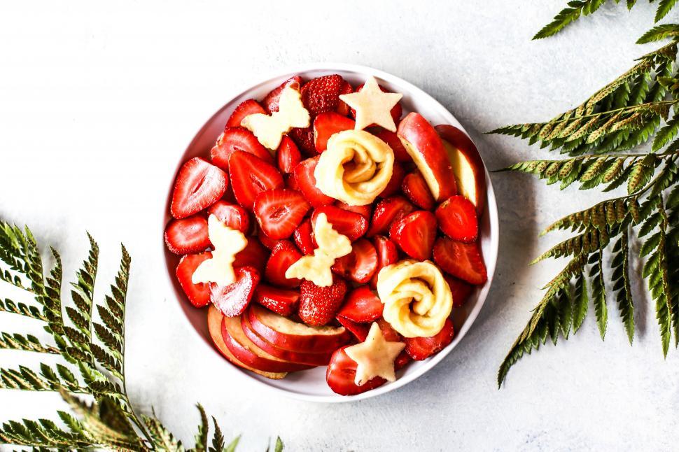 Free Image of A bowl of fruit and cookies 