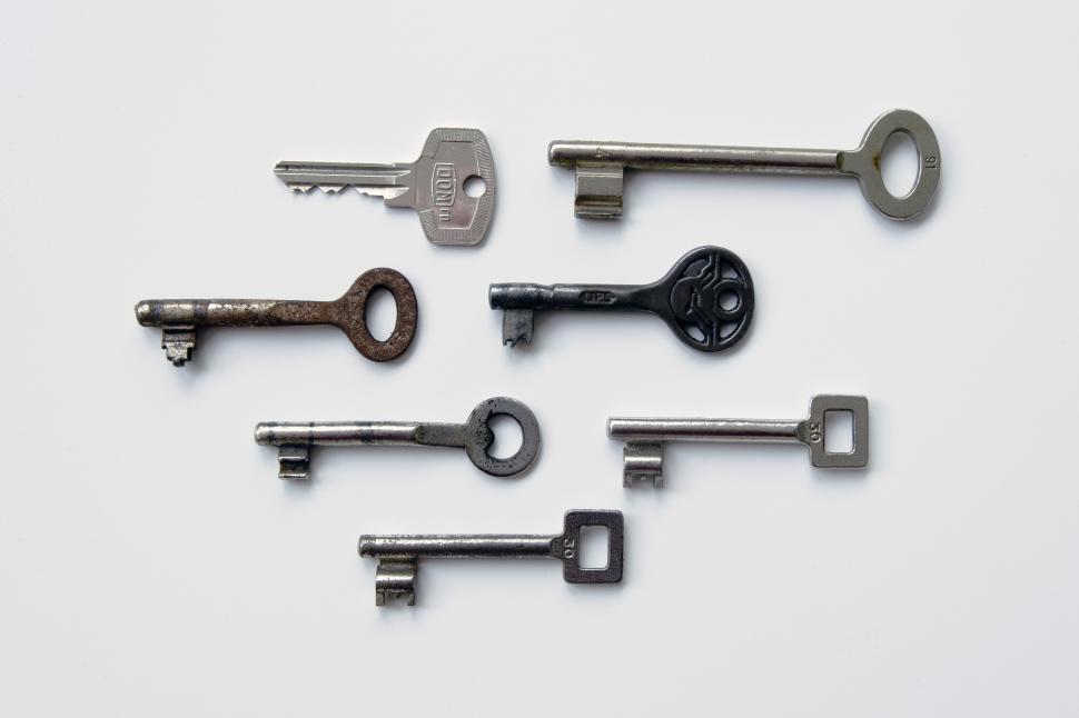 Free Image of A group of keys on a white surface 
