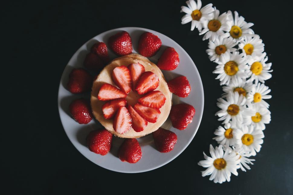 Free Image of A plate of food with strawberries on top 
