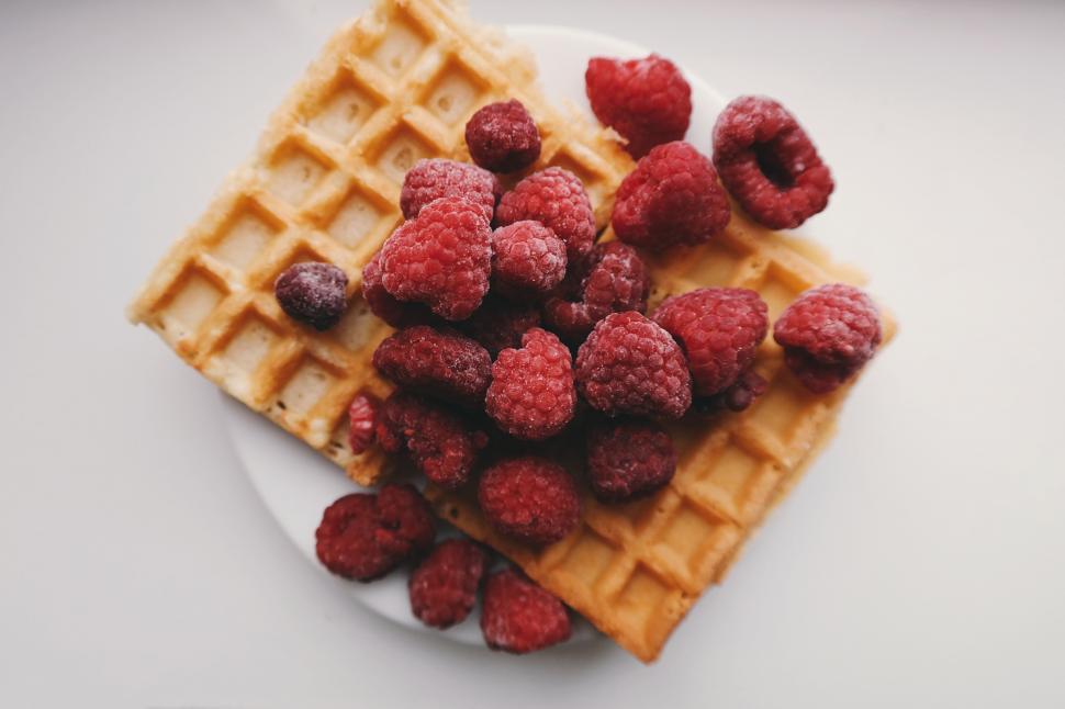 Free Image of A plate of waffles with raspberries 