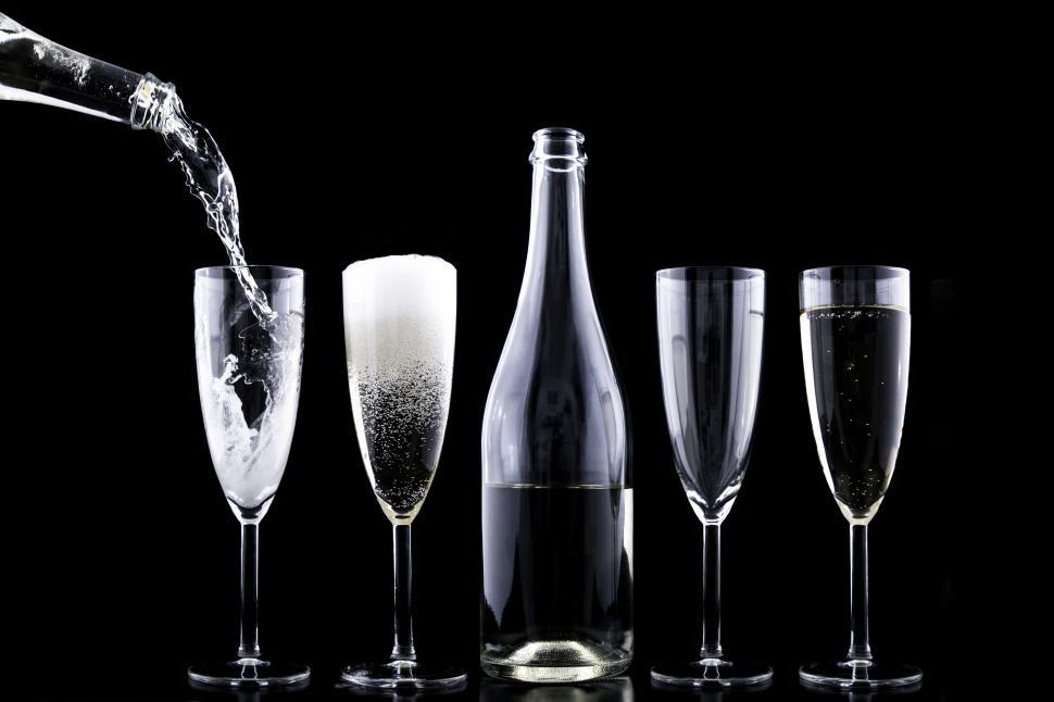Free Image of A group of glasses and a bottle of champagne 
