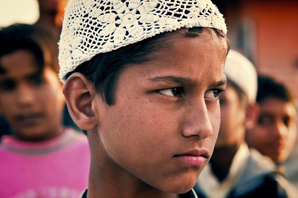 Free Image of A boy wearing a white hat 