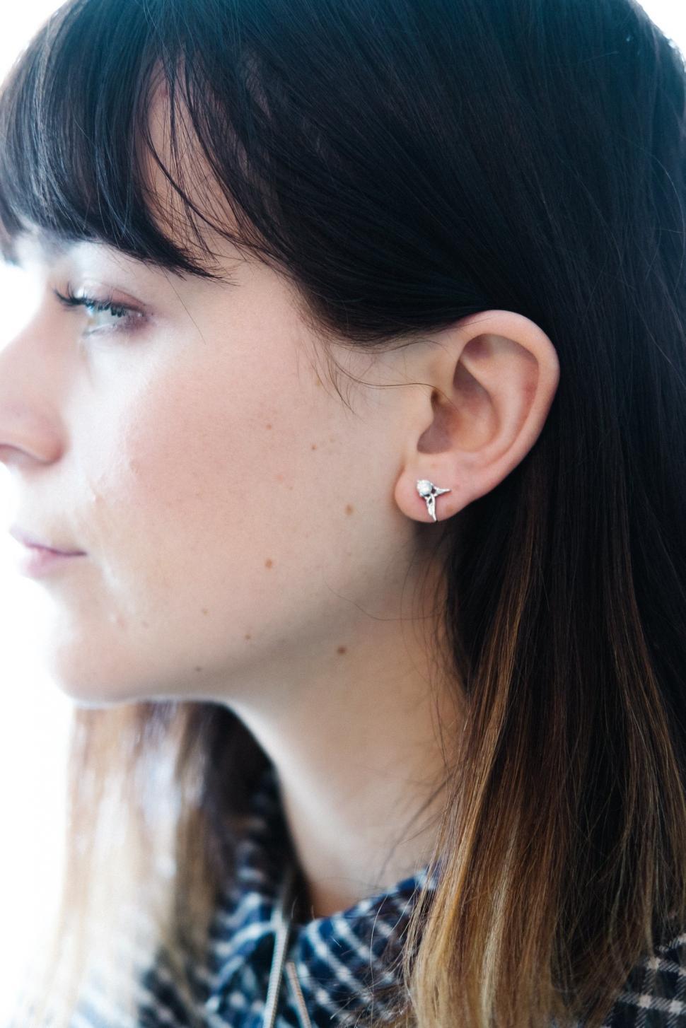 Free Image of A close up of a woman s ear 