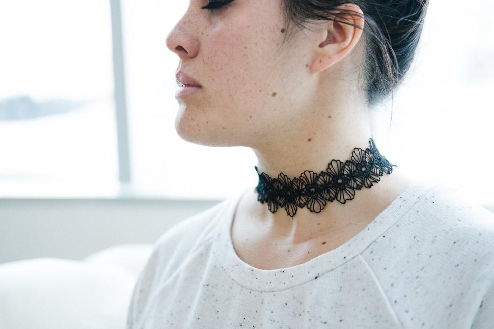 Free Image of A woman with a black choker 