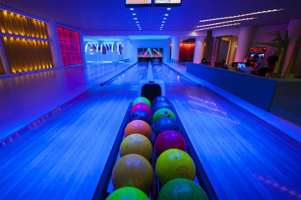 Free Image of A bowling alley with colorful balls 