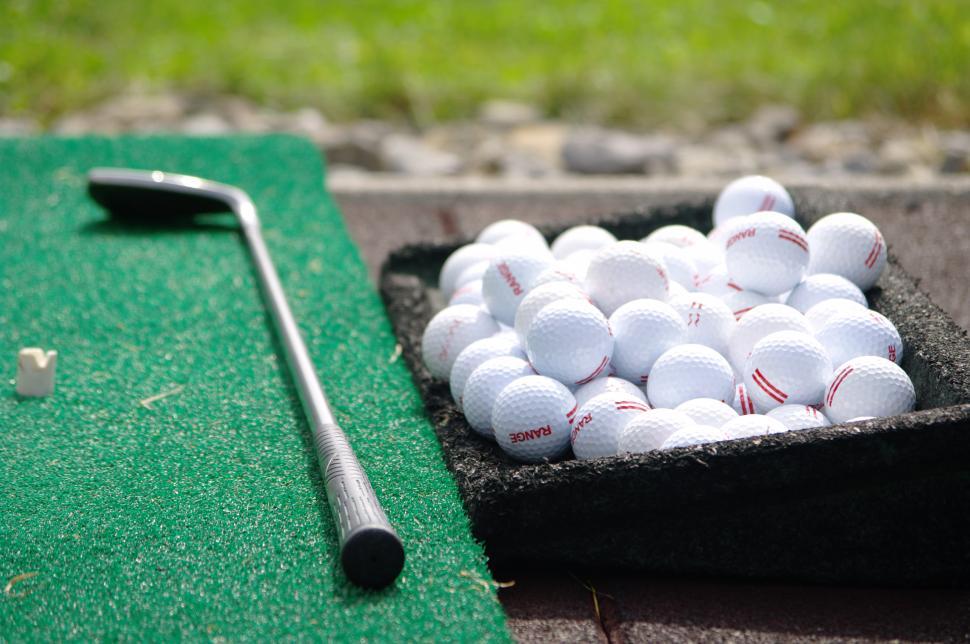 Free Image of Box of Golf Balls and Golf Club 