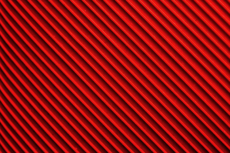 Free Image of A red surface with lines 