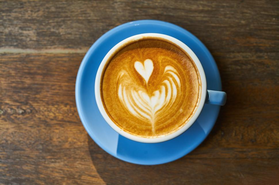 Free Image of A cup of coffee with a heart design in the foam 