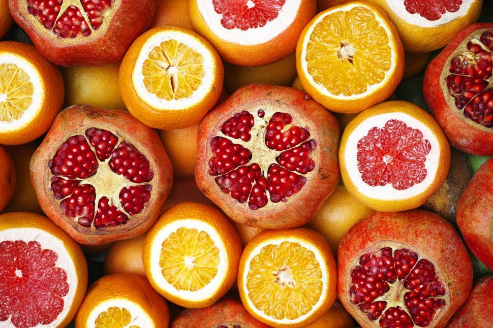 Free Image of A group of oranges and pomegranates 