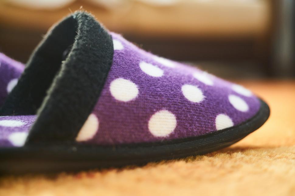 Free Image of A purple slipper with white polka dots 