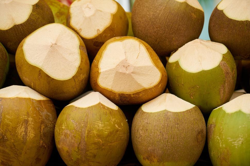 Free Image of A group of coconuts with a cut in half 