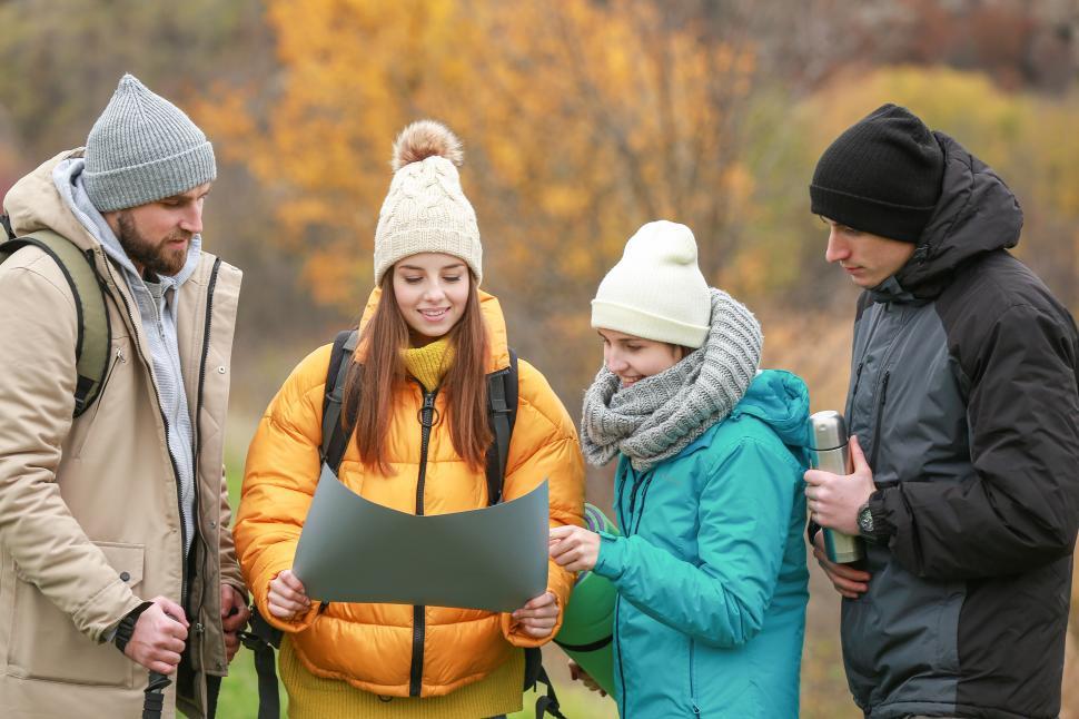 Free Image of A group of people looking at a map 