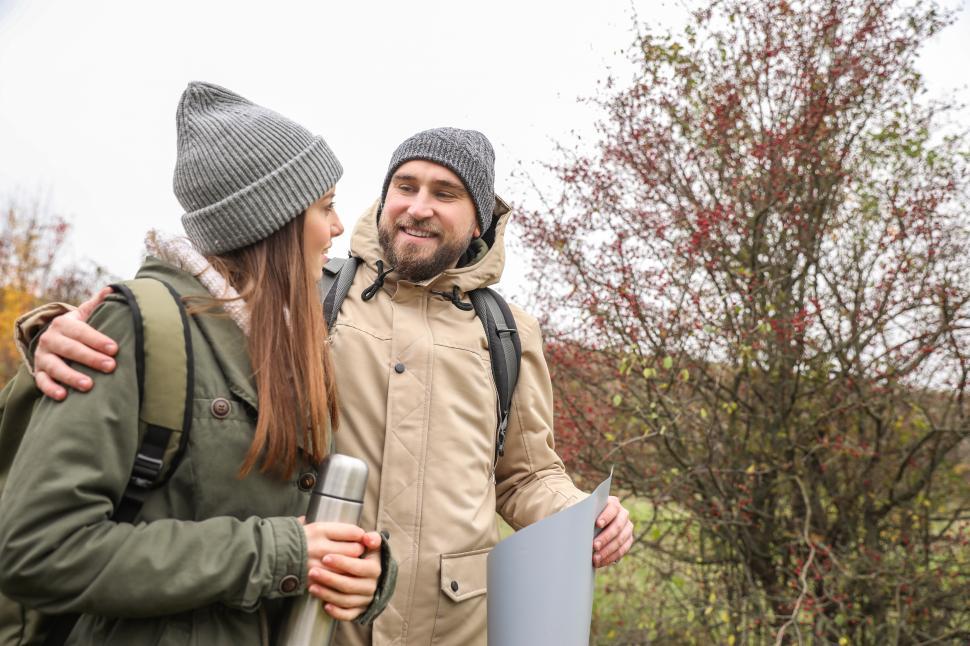 Free Image of A man and woman looking at map 