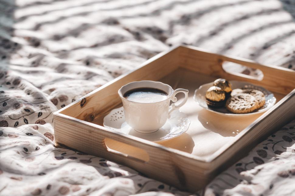 Free Image of A tray with a cup of coffee and cookies on it 